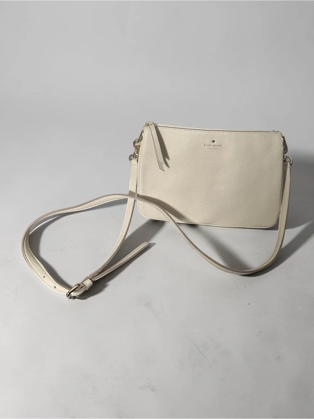 kate spade Pebbled Leather Crossbody Bag in Light Beige
